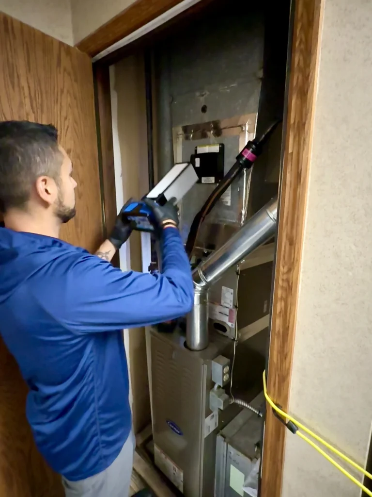 IAQ professional installing oxy 4 iaq unit