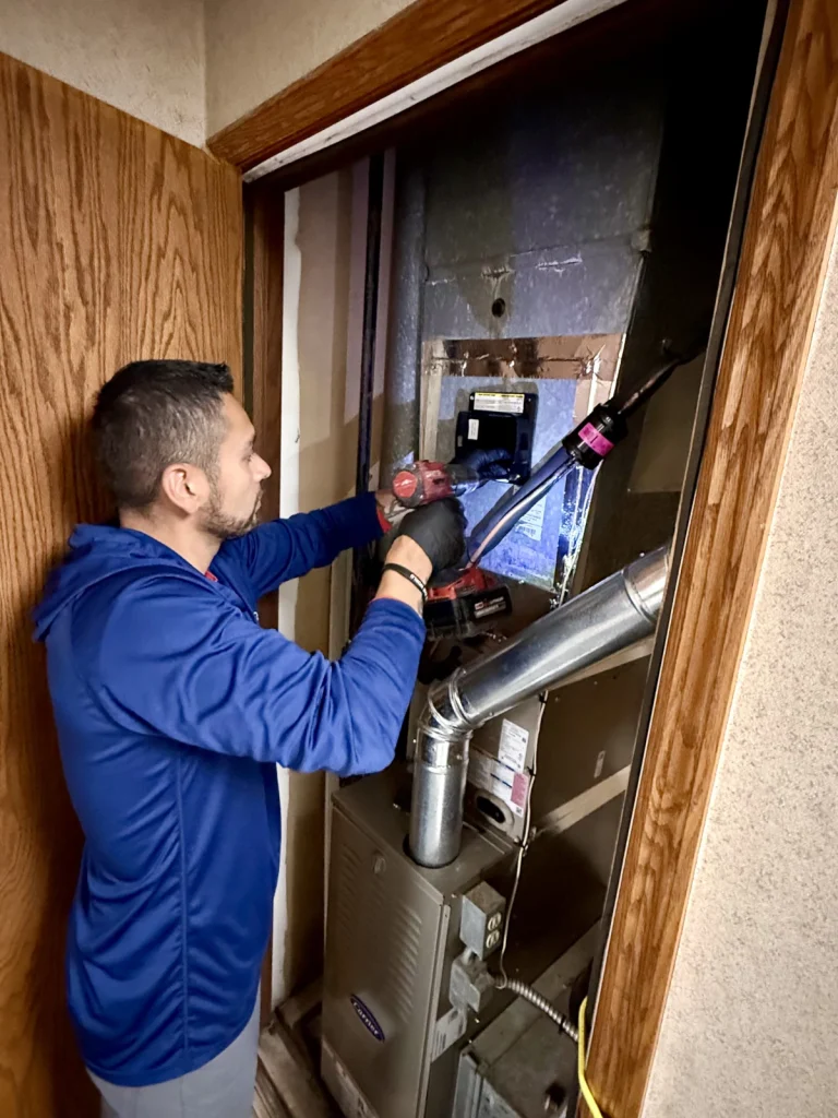 Novak technician testing IAQ unit in animal shelter